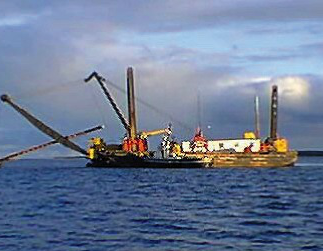 Boat with oil deployment equipment