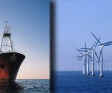 Wind turbines & boat in ocean